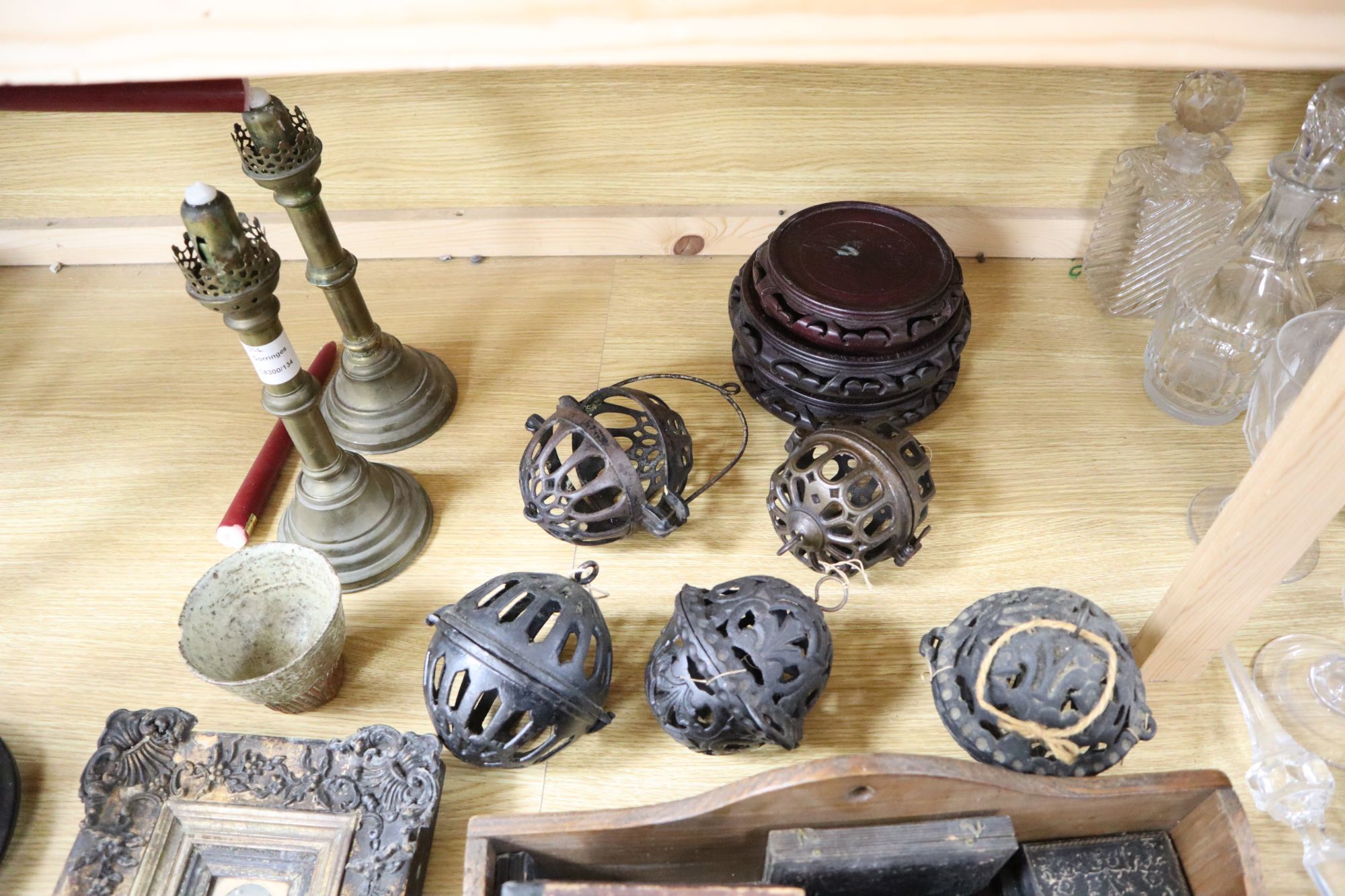 A group of mixed collectables including five pomanders, a pair of brass candlesticks, Oriental stands and a quantity of daguerreotypes